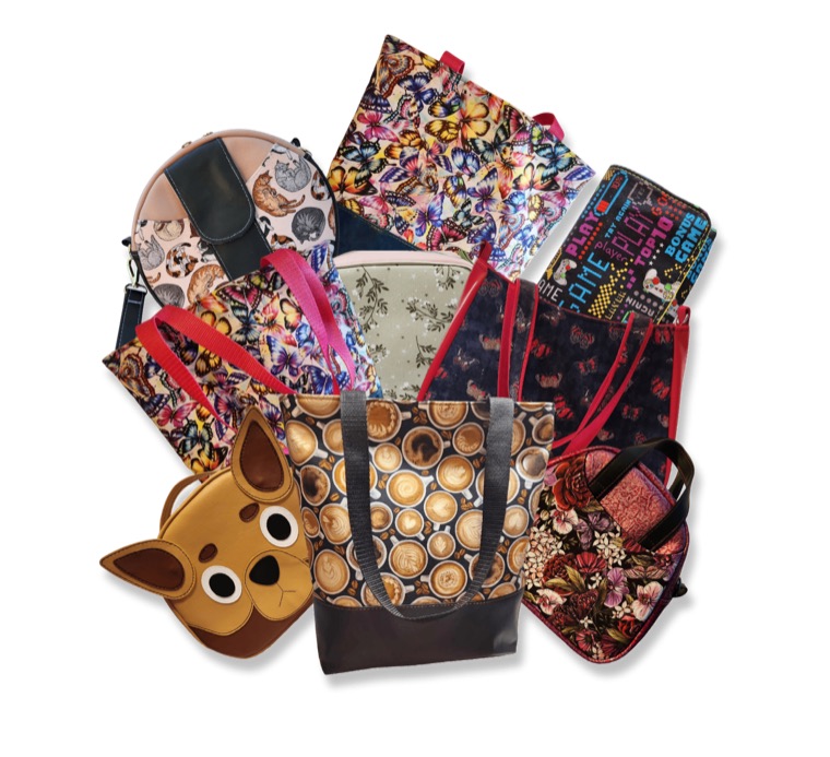A pile of handmade bags in printed and patterned fabrics.